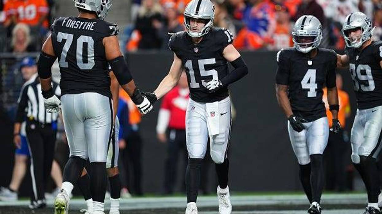 Kenny Pickett #15 of the Las Vegas Raiders runs off the field after throwing a touchdown pass during the fourth quarter against the Denver Broncos at Allegiant Stadium on December 07, 2025 in Las Vegas, Nevada.