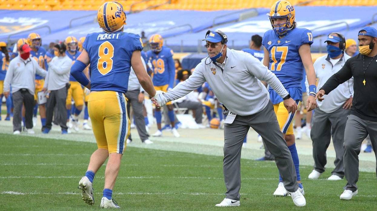 Kenny Pickett slapping five with Pat Narduzzi