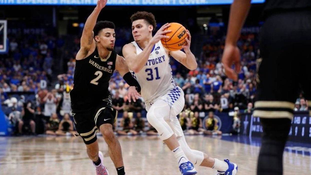 Kentucky Wildcats guard Kellan Grady (31) drives to the basket past Vanderbilt Commodores guard Scotty Pippen Jr. (2) during the SEC MenÃâs Basketball Tournament at Amalie Arena in Tampa, Fl., Friday, March 11, 2022.