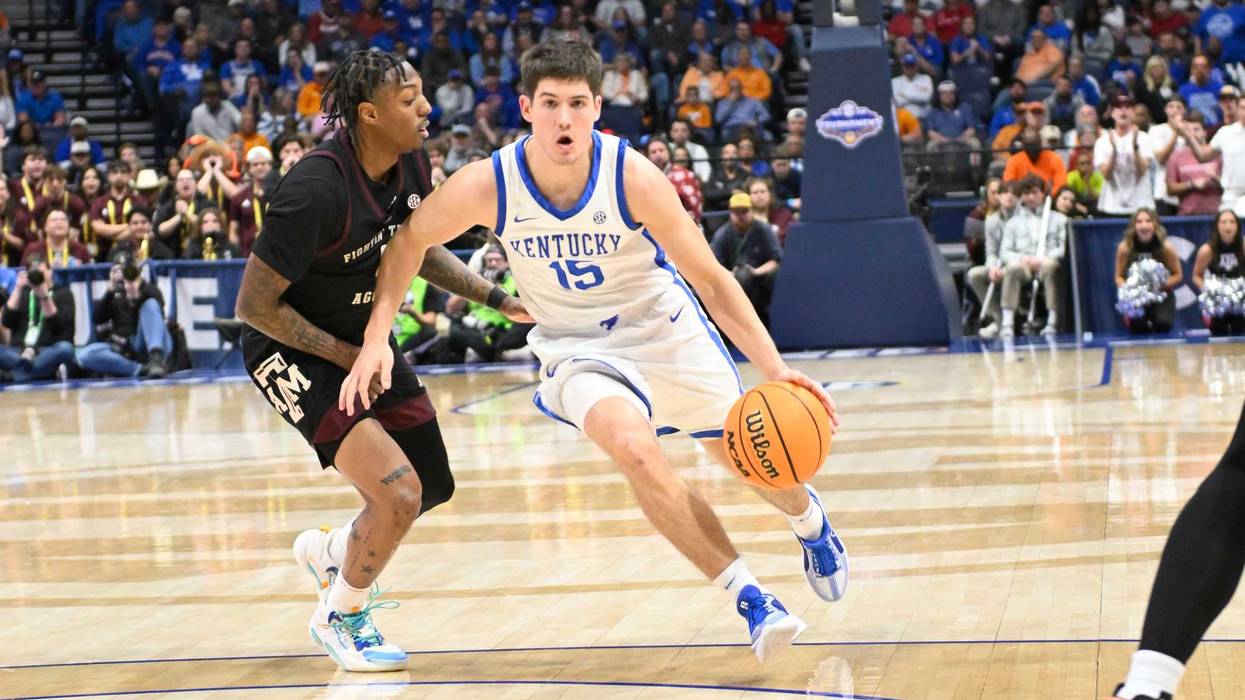 Kentucky Wildcats guard Reed Sheppard (15) drives down the lane against the Texas A&M Aggies during the second half at Bridgestone Arena.