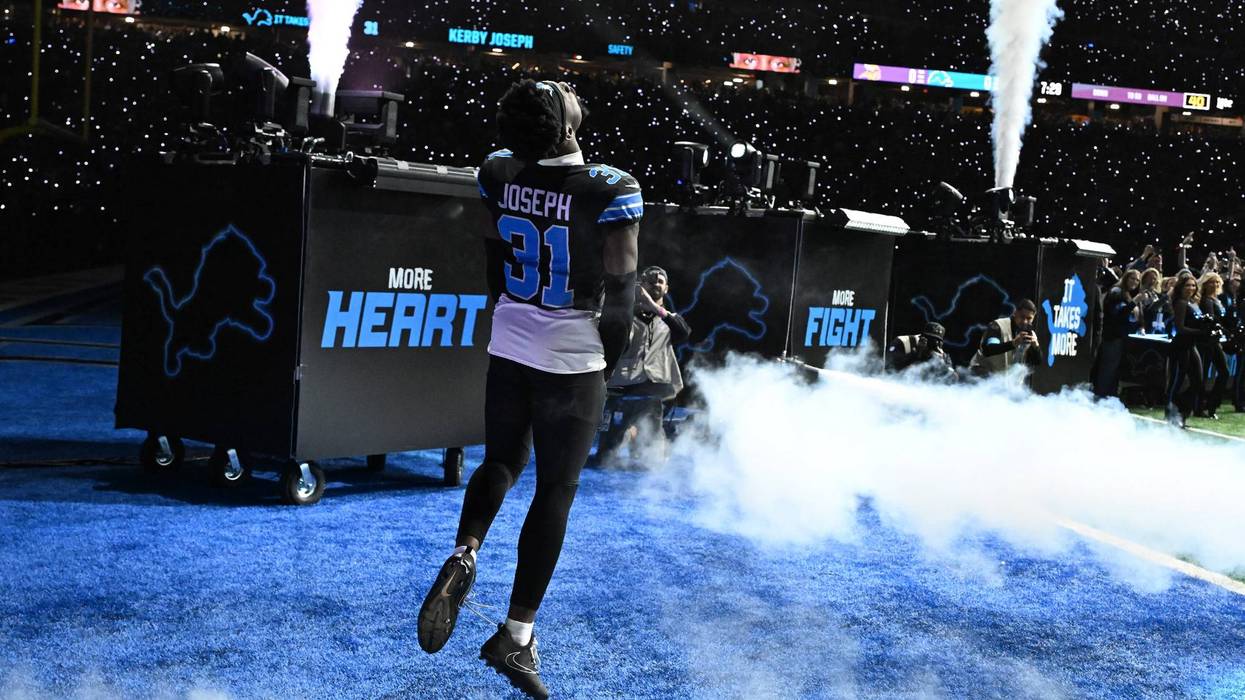 Kerby Joseph runs onto the field during pregame introductions