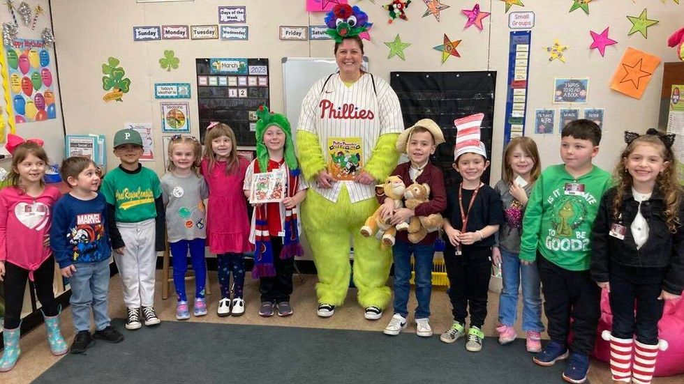 Kerri Lubinsky stands with students at John S. Clark Elementary School in Pottsville, where she is principal.