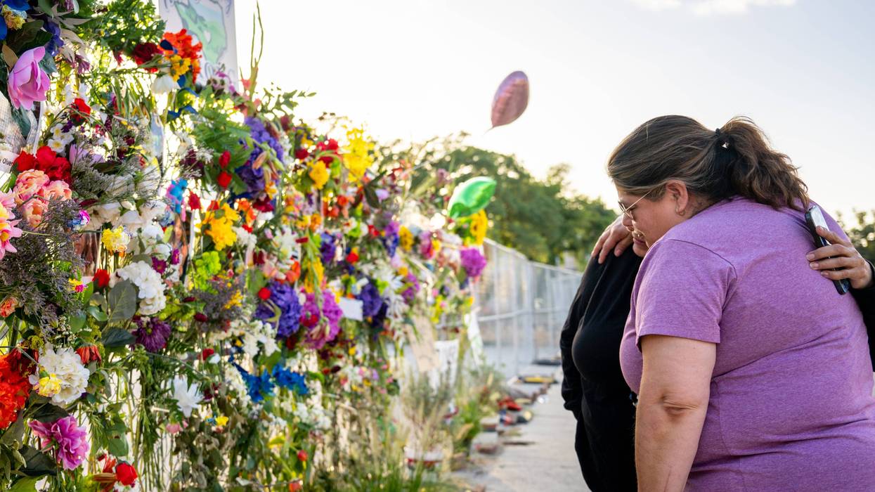 KERRVILLE, TEXAS - JULY 10: Community residents grieve and pay their respects at a memorial on July 10, 2025 in Kerrville, Texas. Last Friday, heavy rainfall caused severe flash flooding throughout the hill country and various cities along the Guadalupe River. (Photo by Brandon Bell/Getty Images)