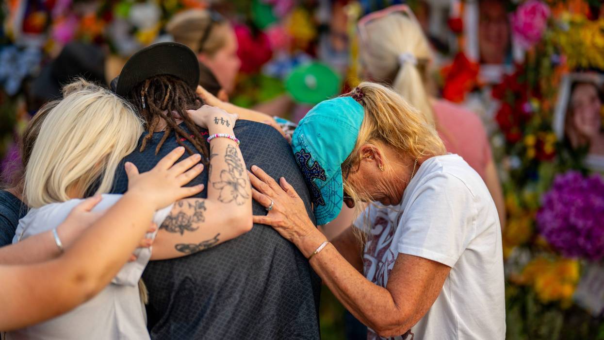 KERRVILLE, TEXAS - JULY 11: Community members gather during a candlelight vigil to honor the lives lost in the flash floods that claimed more than 120 lives on July 11, 2025 in Kerrville, Texas. More than 160 people are still missing after storms cells halted over the area, dumping nearly 15 inches of rain and causing a 22-foot rise along the Guadalupe River. (Photo by Brandon Bell/Getty Images)