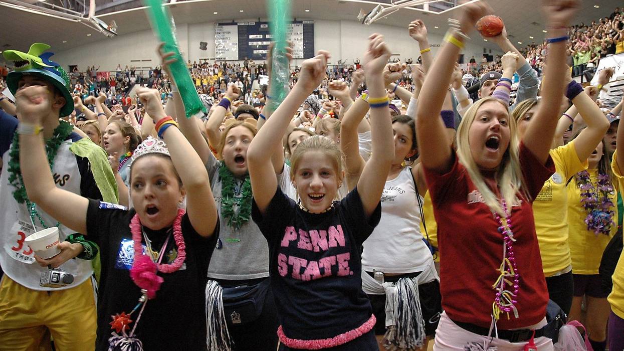 KESTERSON/PHILADELPHIA INQUIRER (February 21) Missy Lau, left, a 21-year-old senior, Lauren Maxham, center, 14, and her sister Diana Maxham, right, a 22 year-old senior dance a line dance during the Penn State "THON," a 48-hour dance marathon. (Photo by smd) 2005 (Diversity)