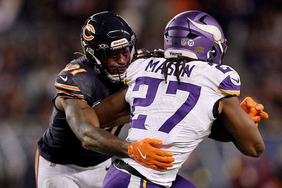 Kevin Byard III #31 of the Chicago Bears makes a tackle on Jordan Mason #27 of the Minnesota Vikings during the game at Soldier Field on September 08, 2025 in Chicago, Illinois.