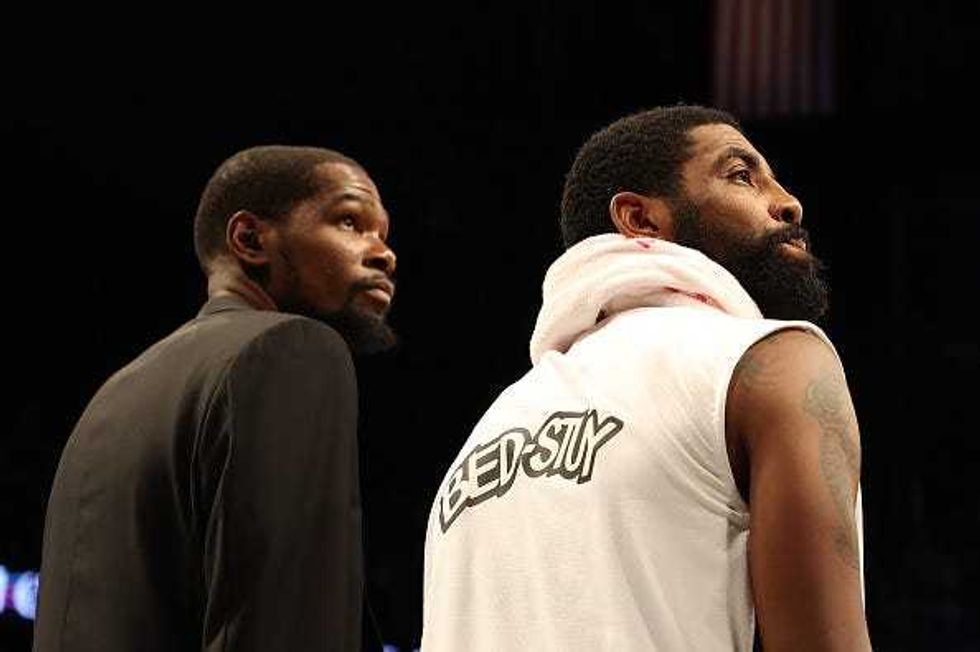 Kevin Durant and Kyrie Irving before a Brooklyn Nets game.