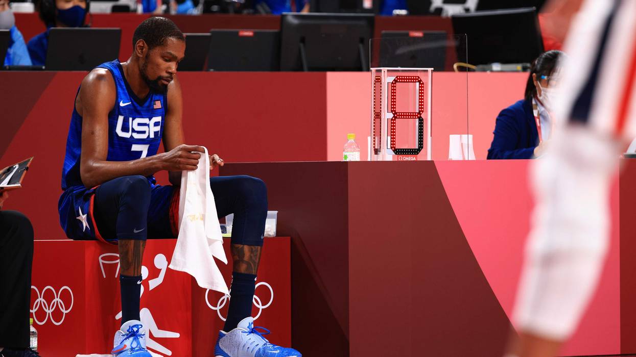 Kevin Durant the U.S. sits on the bench in disappointment as time winds down in the U.S. men's basketball team's loss to France at the Tokyo Olympics, 7/25/21