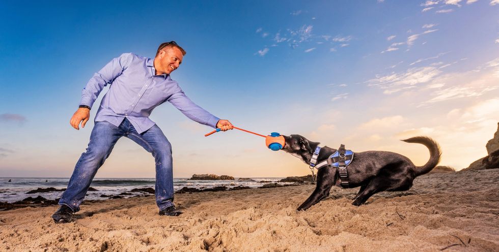 Kevin playing with his dog, Blue