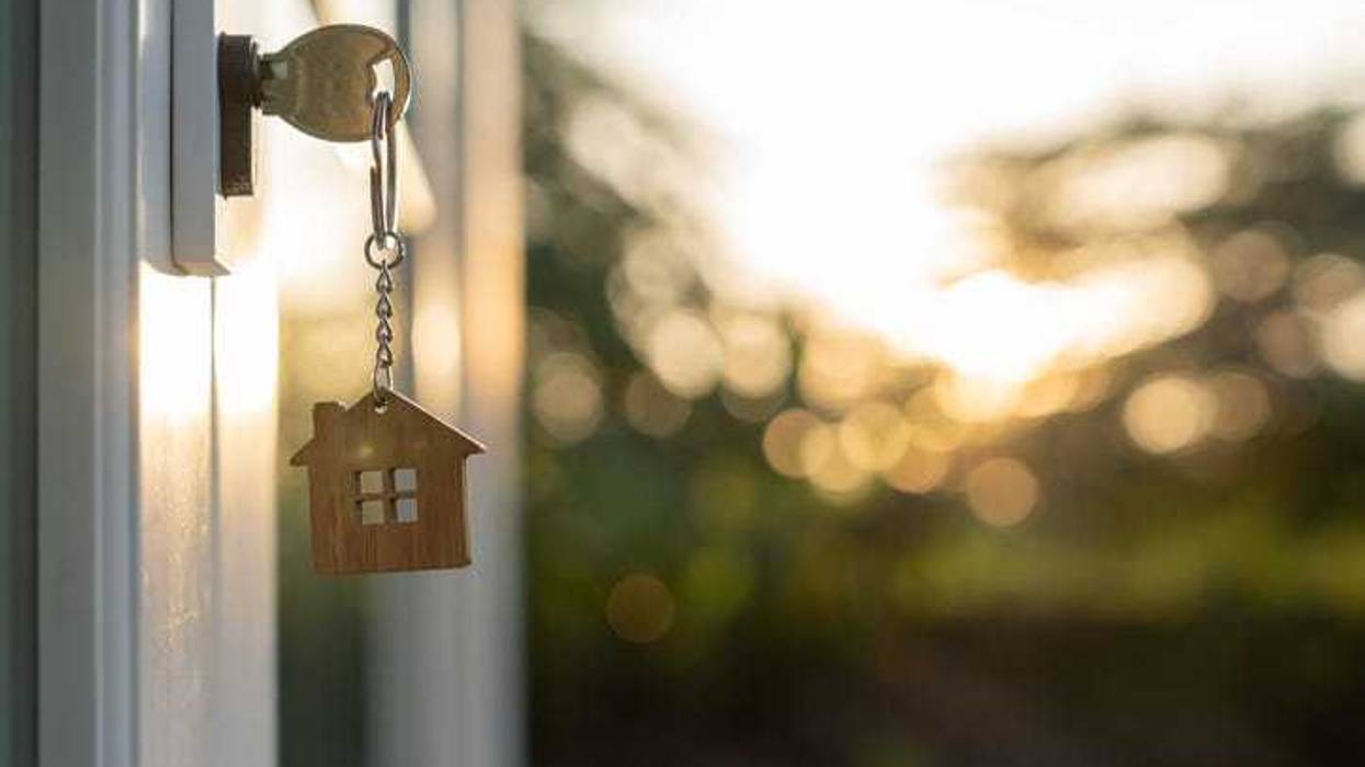 Key in the door to a house.