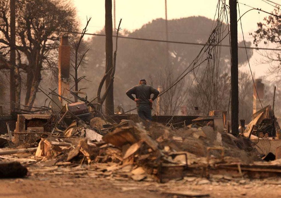 Khaled Fouad stands on the remains of their home that was destroyed by Eaton Fire on January 09, 2025 in Altadena, California. Fueled by intense Santa Ana Winds, the Eaton Fire has grown to over 10,000 acres and has destroyed many homes and businesses.