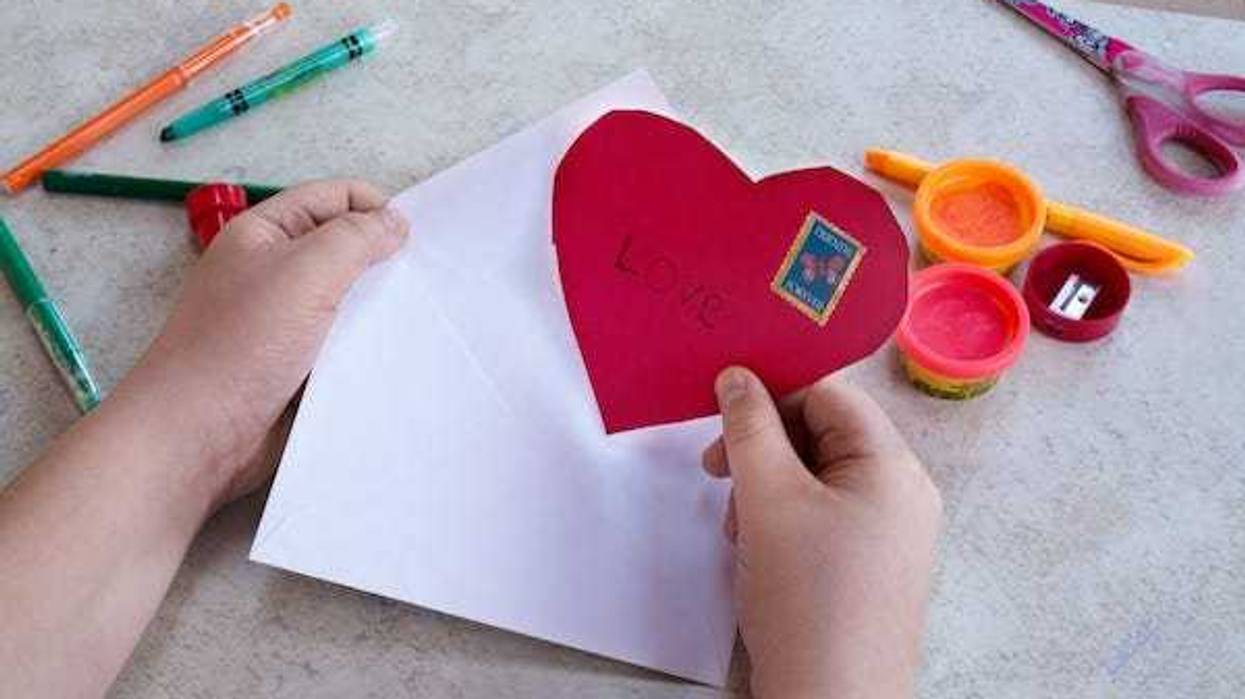 Kid holding a homemade Valentine