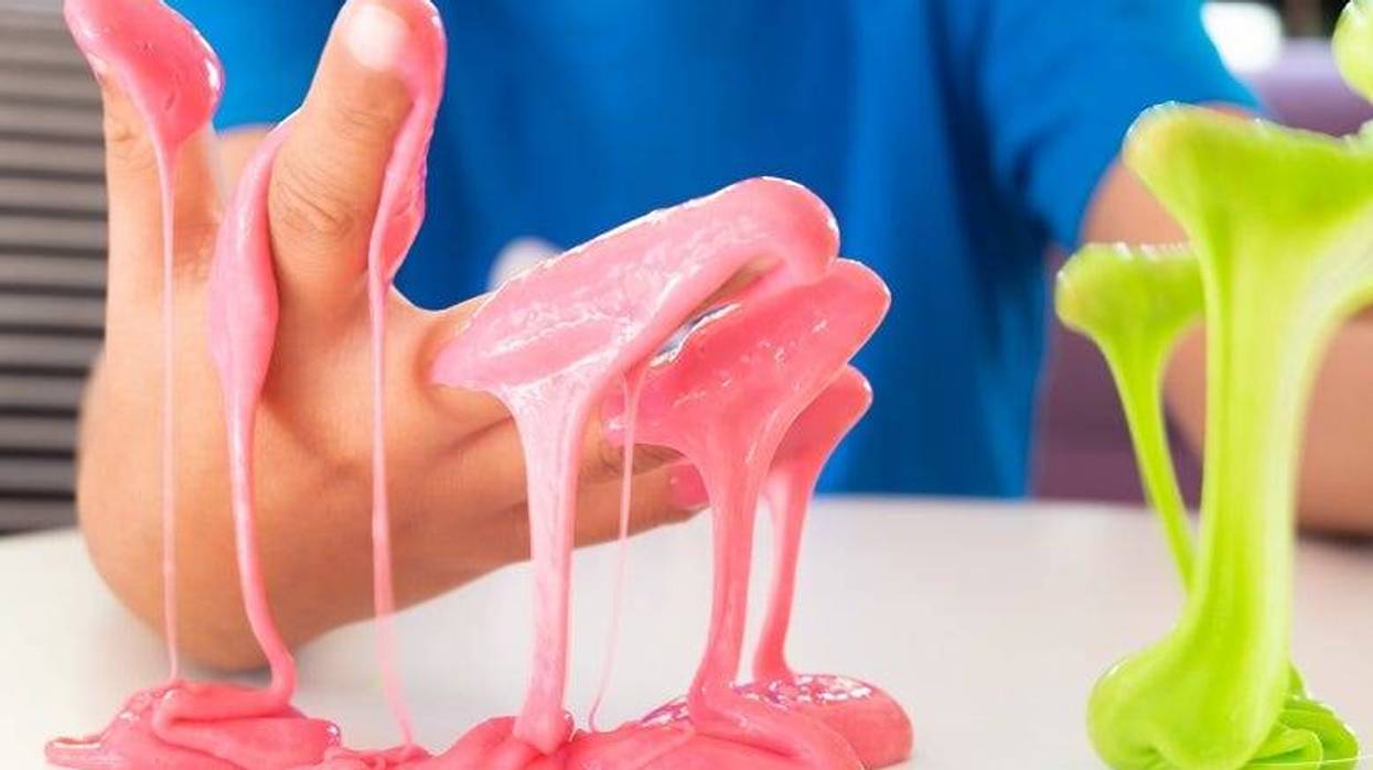 kid playing with slime