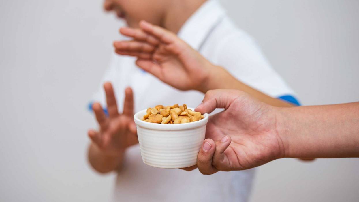 kid recoiling from peanuts