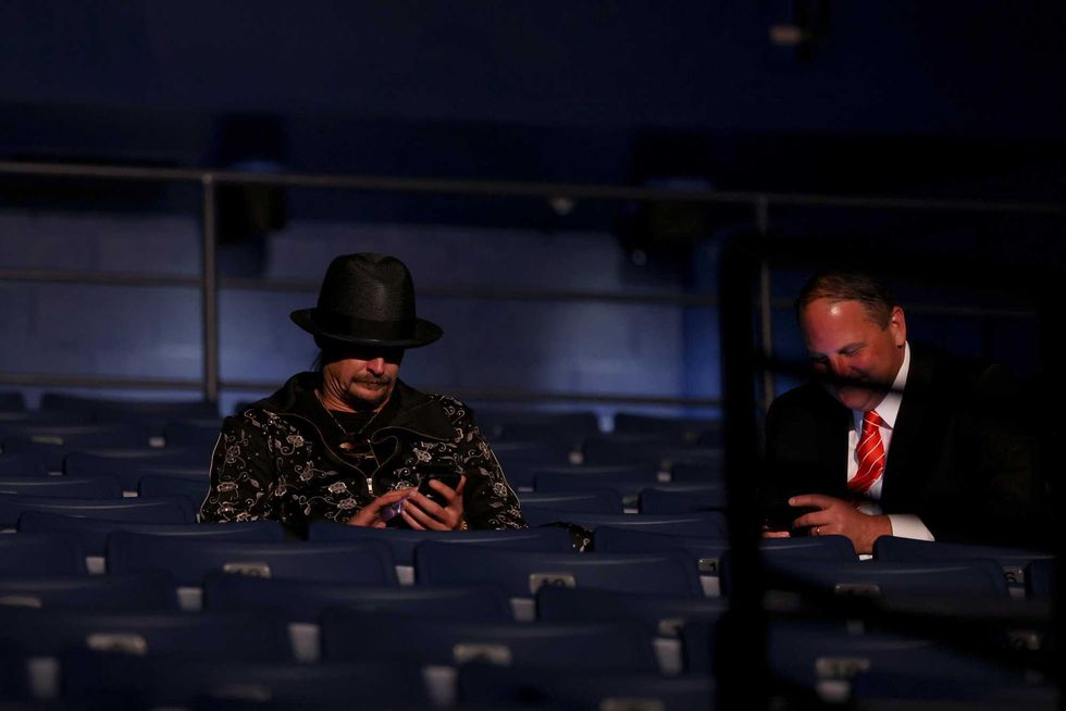 Kid Rock (L) takes his seat without wearing a mask, prior to being asked to wear one, at the final presidential debate between U.S. President Donald Trump and Democratic presidential nominee Joe Biden at Belmont University on October 22, 2020 in Nashville, Tennessee. This is the last debate between the two candidates before the election on November 3.