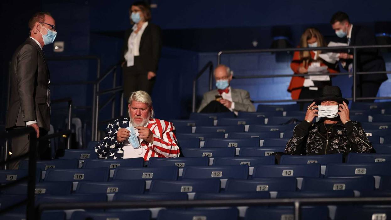 Kid Rock (R) and John Daly are asked to wear masks, at the final presidential debate between U.S. President Donald Trump and Democratic presidential nominee Joe Biden at Belmont University on October 22, 2020 in Nashville, Tennessee.