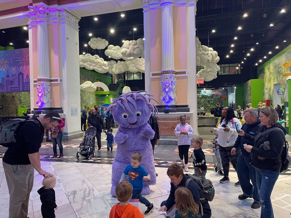 Kids and families gather to watch the ball drop at the Please Touch Museum on New Year