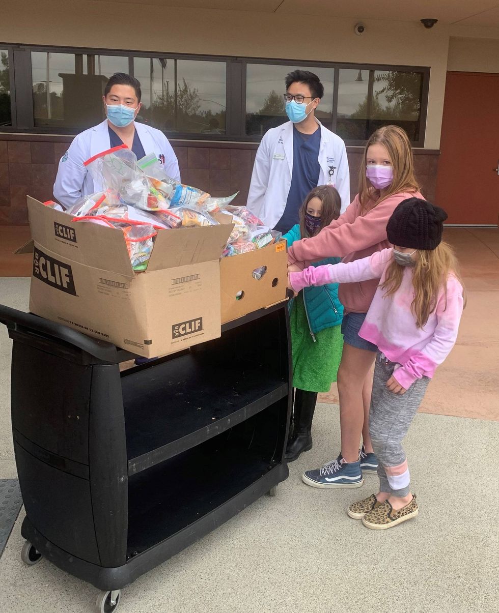 kids delivering sanity bags to doctors
