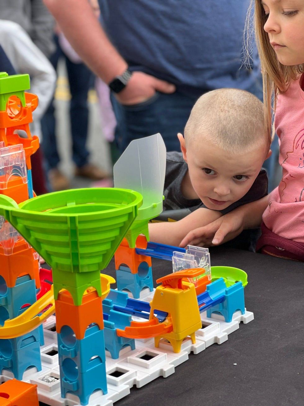 Kids exploring engineering and physics concepts at an exhibit at the iMAGINE Upstate festival