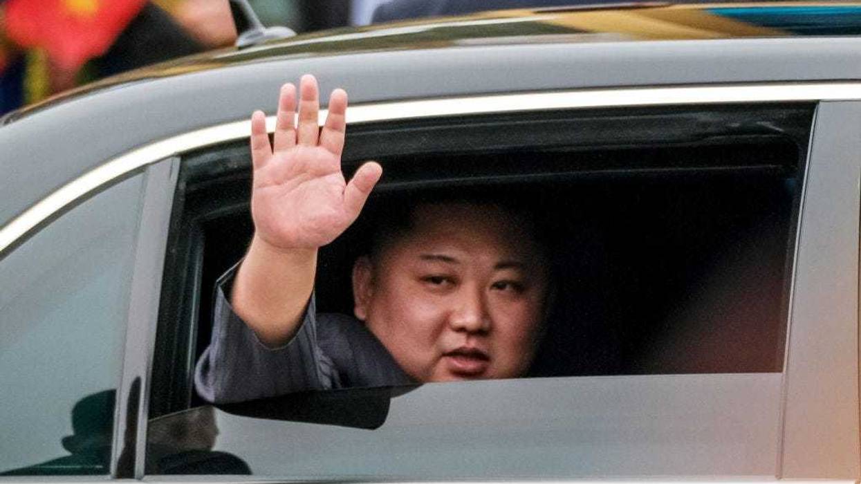 Kim Jong-un waves from his car after arriving by train at Dong Dang railway station near the border with China on February 26, 2019 in Lang Son, Vietnam.