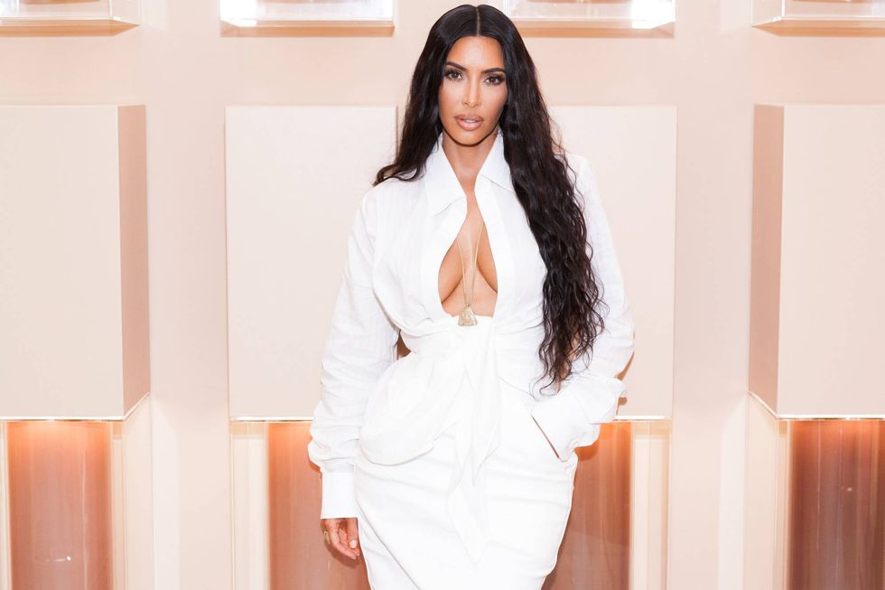 Kim Kardashian shines in tight pink gown at NYFW dinner