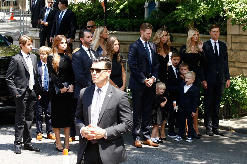 Kimberly Guilfoyle, Donald Trump Jr., Vanessa Trump, Eric Trump, Lara Trump, Ivanka Trump and Jared Kushner pose with their children at the funeral of Ivana Trump at St. Vincent Ferrer Roman Catholic Church on July 20, 2022 in New York City