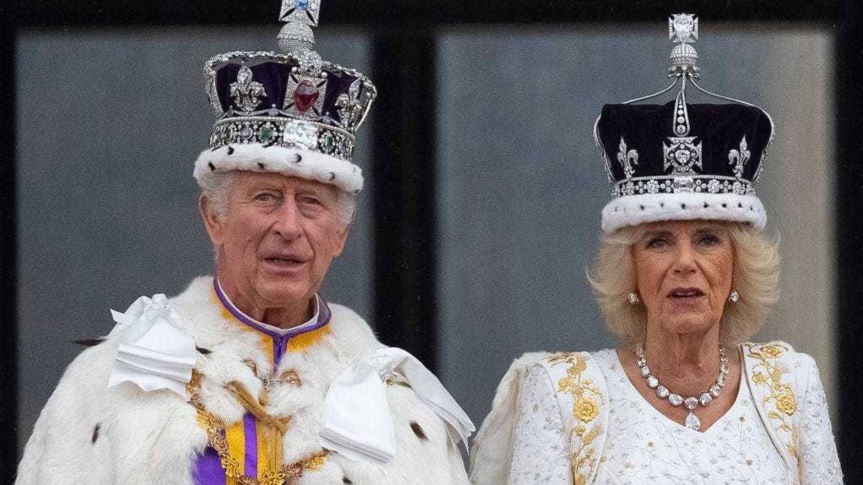 King Charles III and Queen Camilla are seen on the Buckingham Palace balcony during the flypast during the Coronation of King Charles III and Queen Camilla on May 06, 2023 in London, England. The Coronation of Charles III and his wife, Camilla, as King and Queen of the United Kingdom of Great Britain and Northern Ireland, and the other Commonwealth realms takes place at Westminster Abbey today. Charles acceded to the throne on 8 September 2022, upon the death of his mother, Elizabeth II. (Photo by Christopher Furlong/Getty Images)