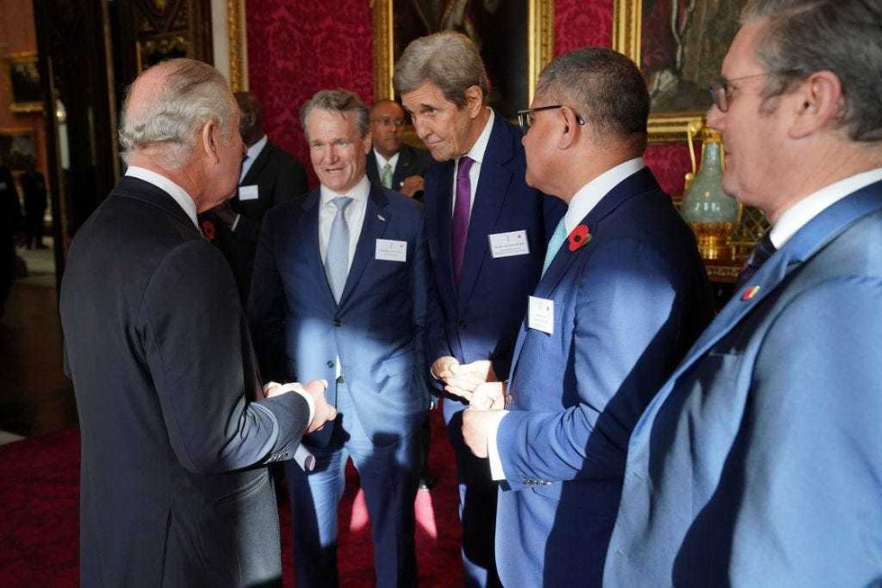 King Charles III (far left) speaks with, (left to tight) Brian Moynihan, Chair and CEO of Bank of America and Co-Chair of Sustainable Markets Initiative, US Special Presidential Envoy for Climate John Kerry, Alok Sharma and Labour leader Keir Starmer during a reception at Buckingham Palace ahead of the Cop27 Summit on November 4, 2022, in London, England. King Charles III will miss the gathering of world figures in Egypt next week but is likely to discuss issues around Cop27 and climate change with those invited to his royal residence. (Photo by Jonathan Brady - Pool/Getty Images)