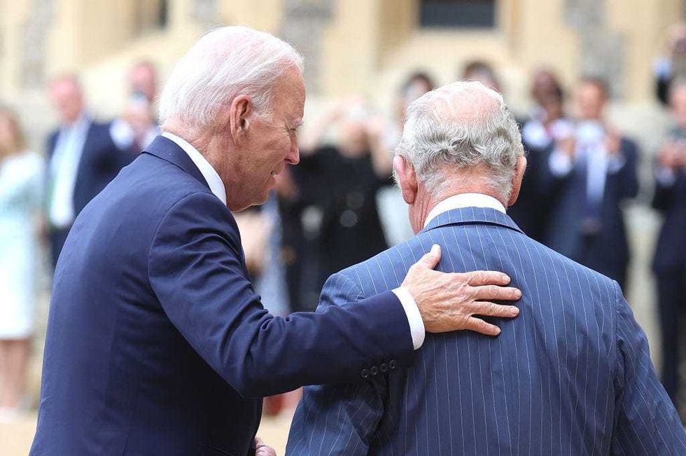 King Charles III greets The President of the United States, Joe Biden in the Quadrangle at Windsor Castle as part of a ceremonial welcome on July 10, 2023 in Windsor, England. The President is visiting the UK to further strengthen the close relationship between the two nations and to discuss climate issues with King Charles III. (Photo by Chris Jackson/Getty Images)