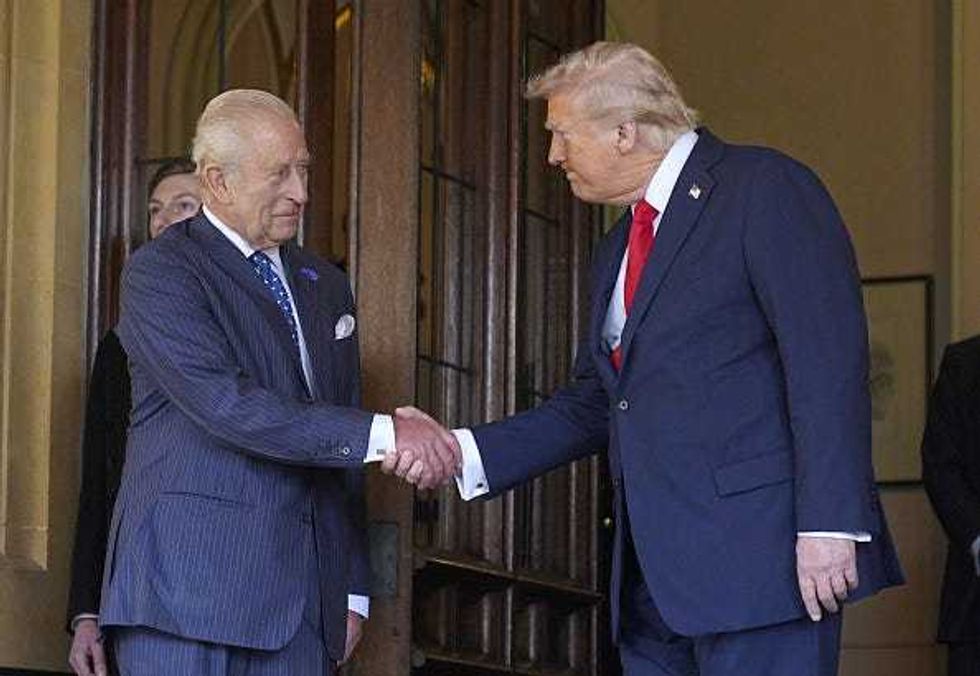 King Charles III (L) bids farewell to US President Donald Trump at Windsor Castle on day three of the President