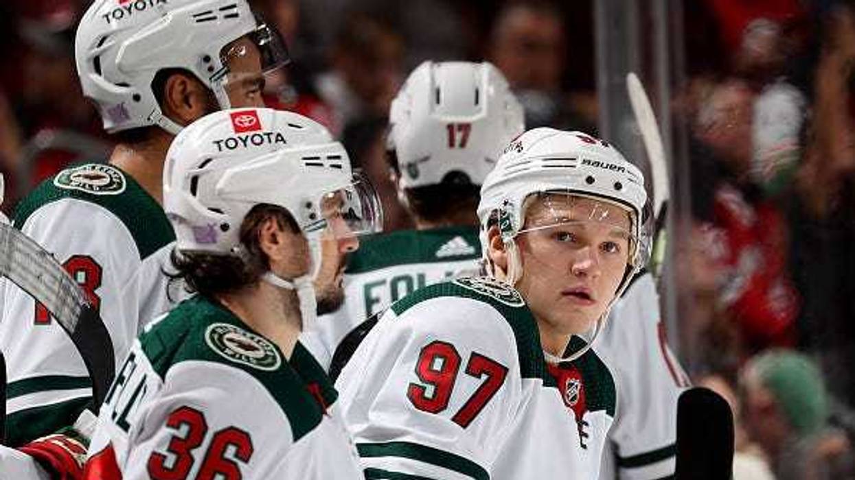 Kirill Kaprizov #97 of the Minnesota Wild looks on from the bench against the New Jersey Devils at Prudential Center on November 24, 2021 in Newark, New Jersey.