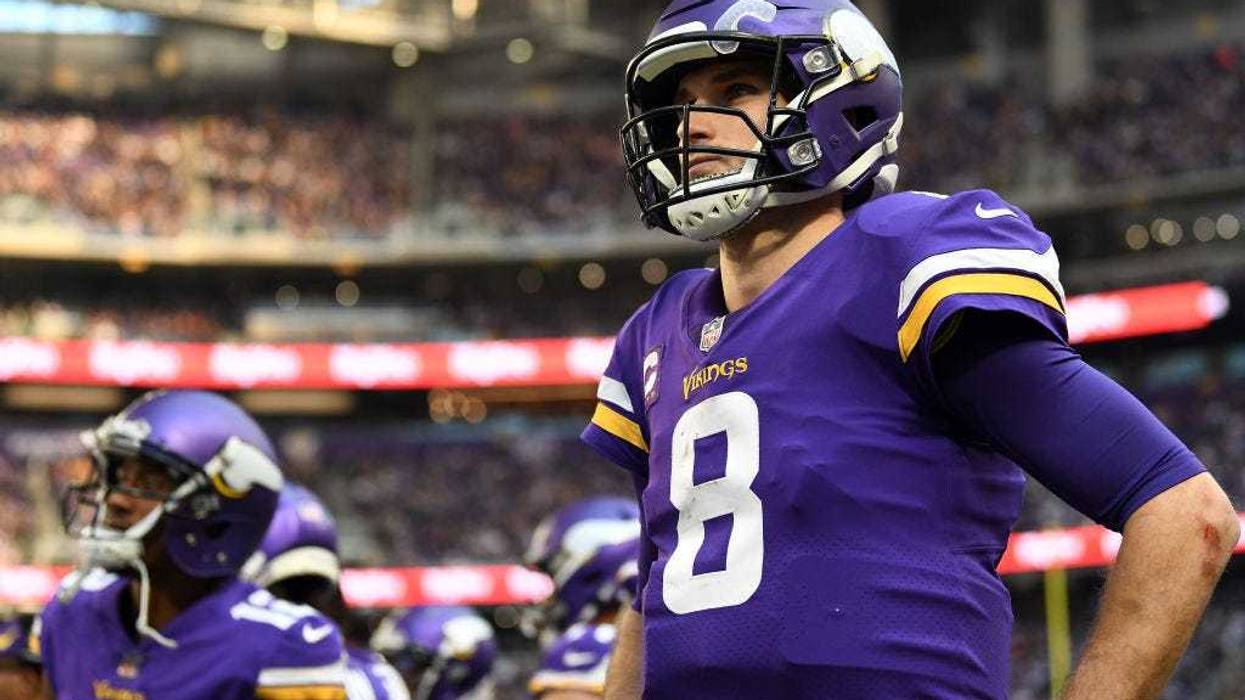 Kirk Cousins #8 of the Minnesota Vikings looks on from the sidelines during the game against the Chicago Bears at U.S. Bank Stadium on January 09, 2022 in Minneapolis, Minnesota.