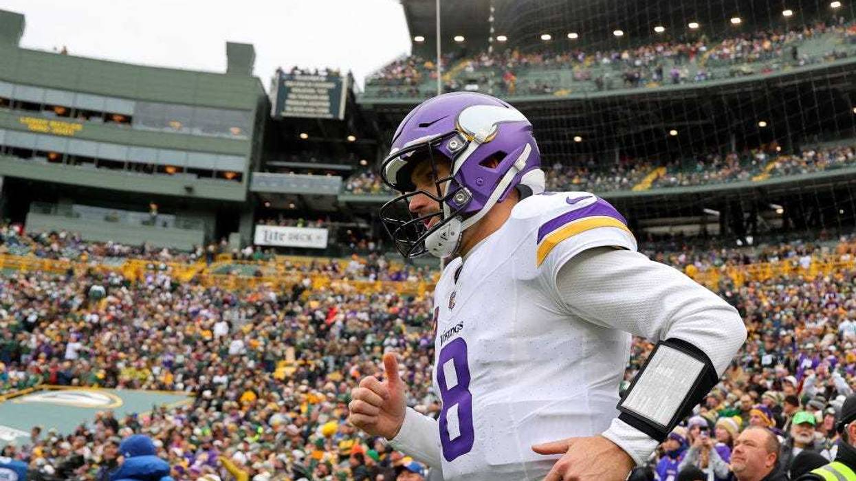 Kirk Cousins #8 of the Minnesota Vikings takes to the field prior to a game against the Green Bay Packers at Lambeau Field on October 29, 2023 in Green Bay, Wisconsin.