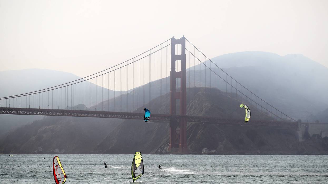 Kiteboarders and windsurfers enjoy the strong winds near the Golden Gate Bridge even with heavy smoke from the nearby wild fires on August 20, 2020 in San Francisco, California.