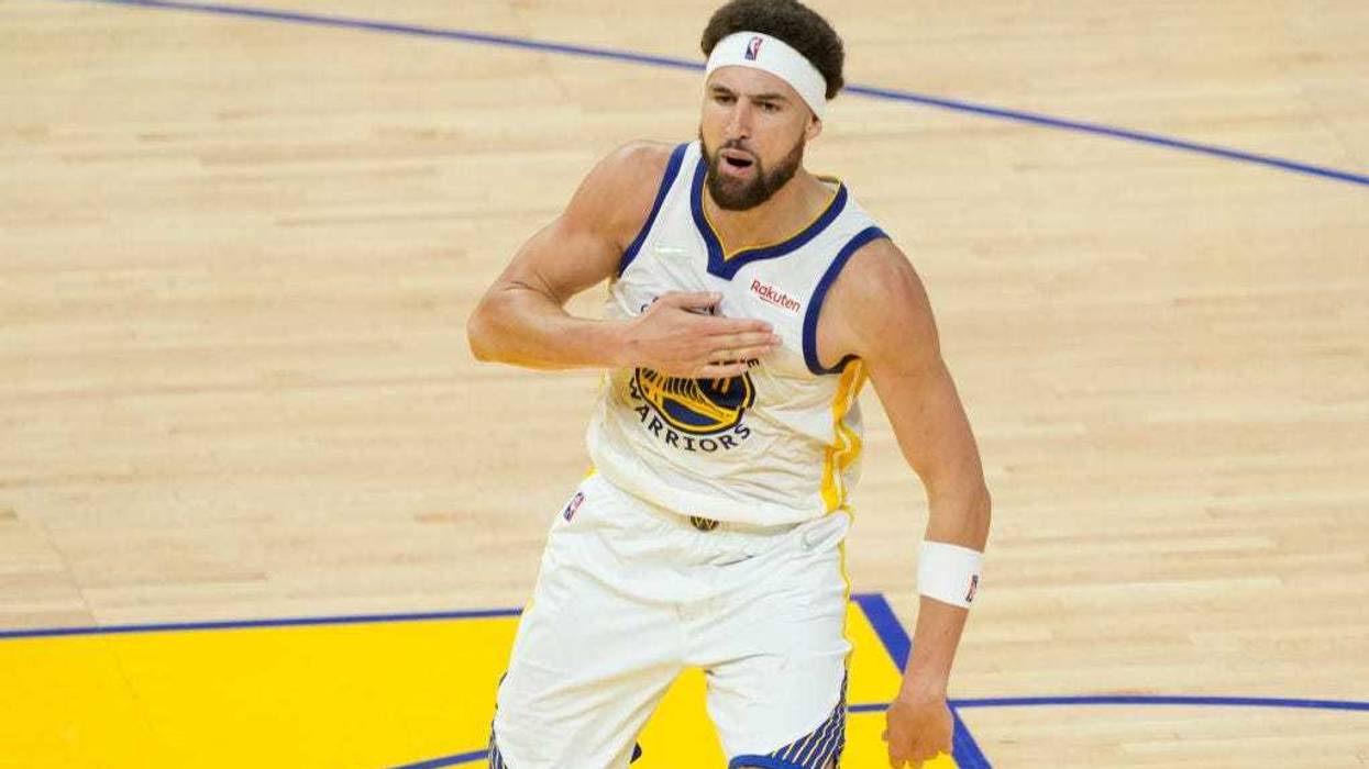Klay Thompson #11 of the Golden State Warriors celebrates a three point basket during the fourth quarter against the Boston Celtics in Game Five of the 2022 NBA Finals at Chase Center on June 13, 2022 in San Francisco, California.