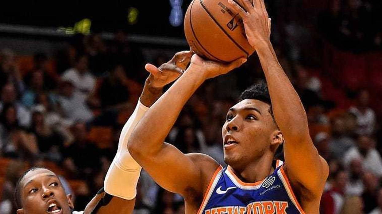 Knicks guard Allonzo Trier shoots over Miami Heat guard Josh Richardson on Oct. 24, 2018, at American Airlines Arena in Miami.