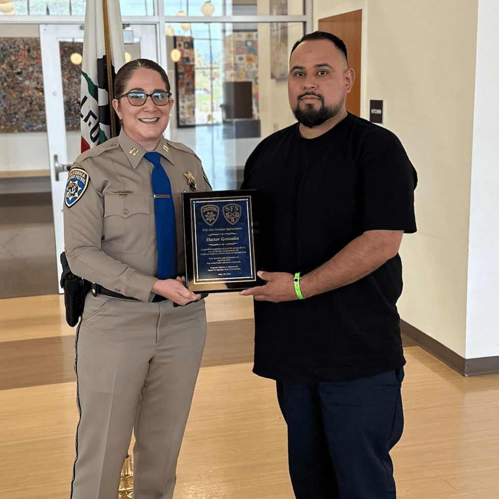 KNX Hero of the Week Hector Gonzalez (right) honored by CHP for saving Officer G. Chavez (not pictured)