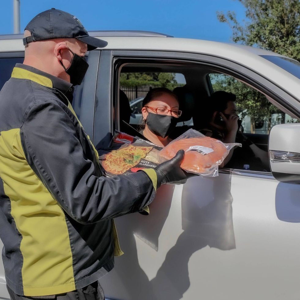 KNX passing out food