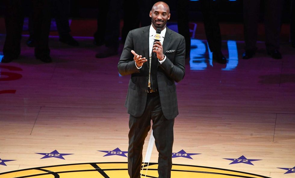 Kobe Bryant addresses the Staples Center crowd during a halftime ceremony to retire his two uniforms numbers, 8 and 24.