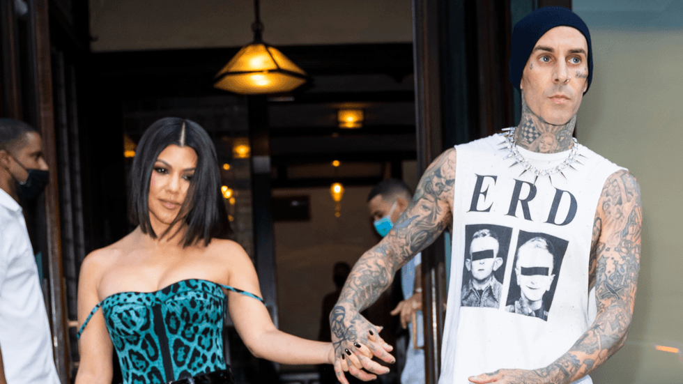 Kourtney Kardashian is keeping Travis Barker close to her heart with blinged out necklace