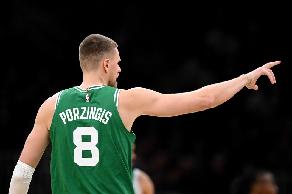 Kristaps Porzingis #8 of the Boston Celtics reacts after making a three-point basket against the Chicago Bulls during the third quarter at the TD Garden on January 29, 2025 in Boston, Massachusetts.