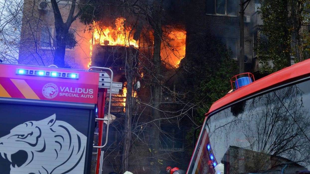 KYIV, UKRAINE - 2022/11/15: A fire is seen at a residential building hit by a Russian strike amid Russia's attack on Ukraine in Kyiv.