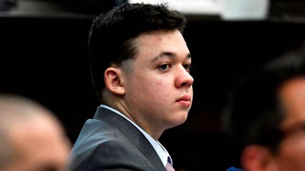 Kyle Rittenhouse listens as jurors are asked questions by the judge during jury selection at the Kenosha County Courthouse on November 01, 2021 in Kenosha, Wisconsin. Rittenhouse shot three demonstrators, killing two of them, during a night of unrest that erupted in Kenosha after a police officer shot Jacob Blake seven times in the back while police attempted to arrest him in August 2020.