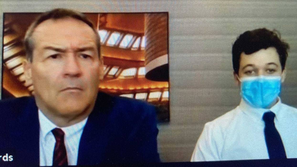 Kyle Rittenhouse, right, with his attorney, Mark Richards, during a Zoom court hearing Feb. 11.