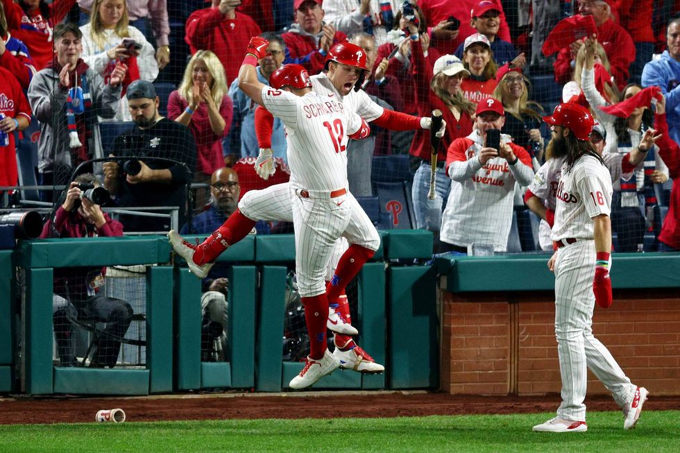Kyle Schwarber, #12 of the Philadelphia Phillies, celebrates his home run with teammate Rhys Hoskins, #17, during the fifth inning against the Houston Astros in Game 3 of the 2022 World Series at Citizens Bank Park on Nov. 1, 2022, in Philadelphia, Pennsylvania.