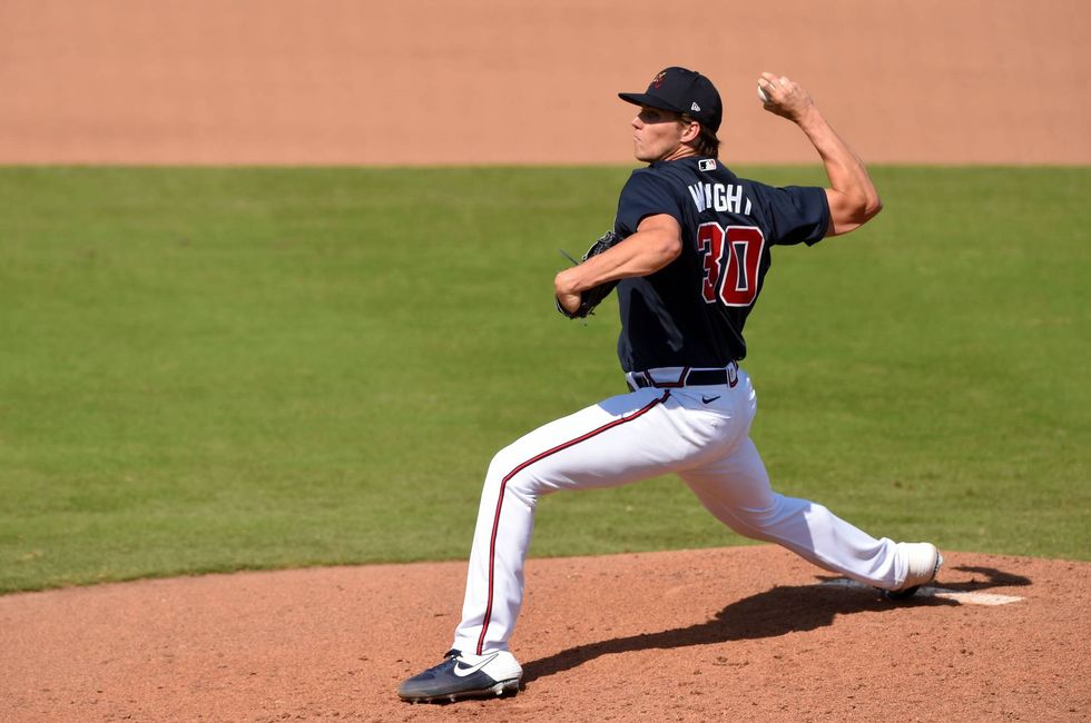 Kyle Wright pitches for the Braves in a spring training game.