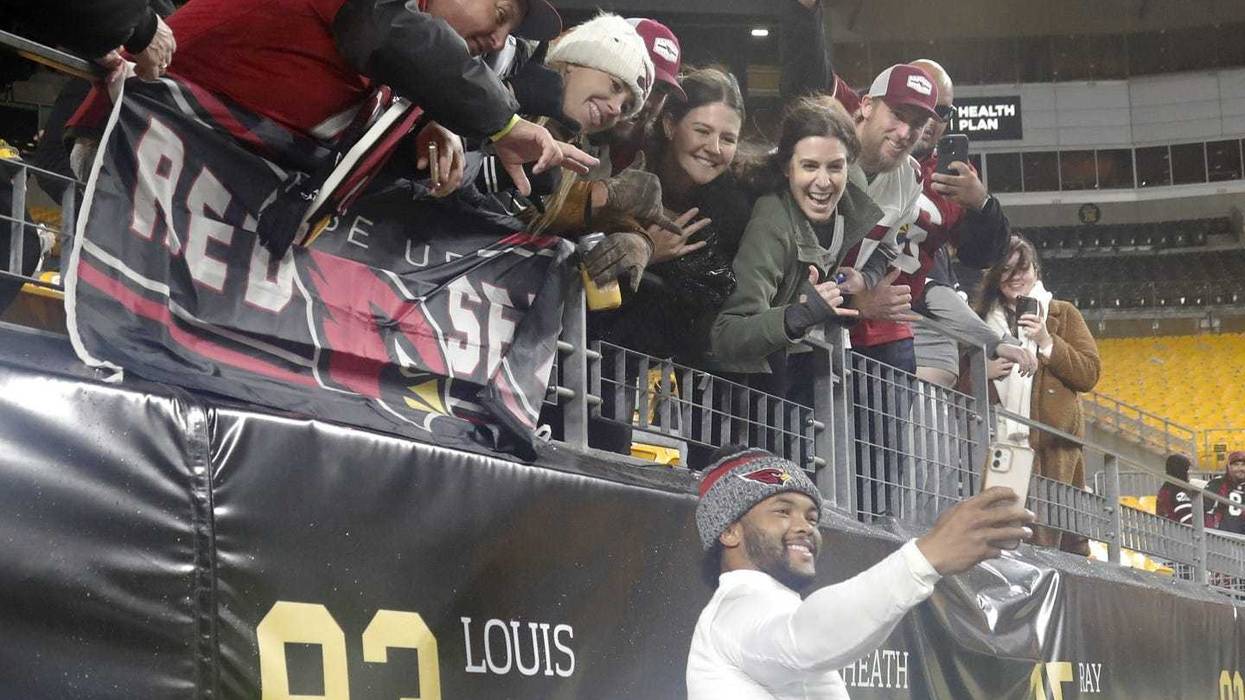 Kyler Murray taking a selfie with Cardinals fans