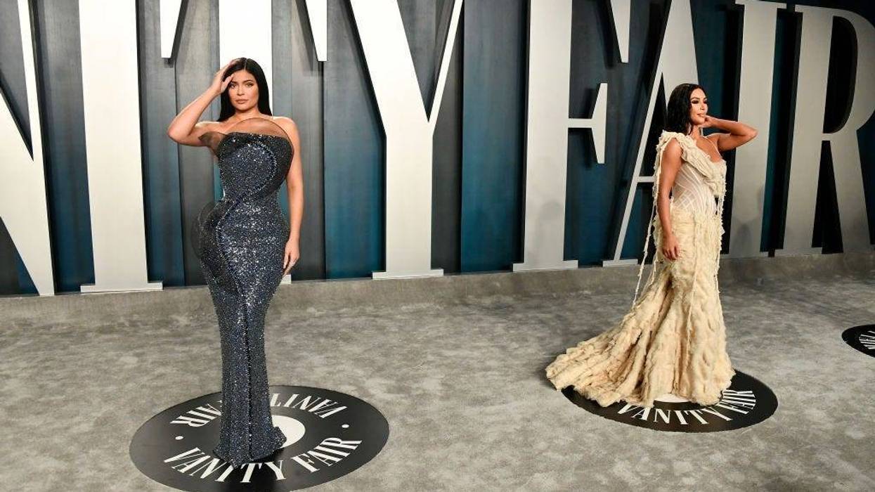 Kylie Jenner and Kim Kardashian (R) attend the 2020 Vanity Fair Oscar Party hosted by Radhika Jones in Beverly Hills, CA.
