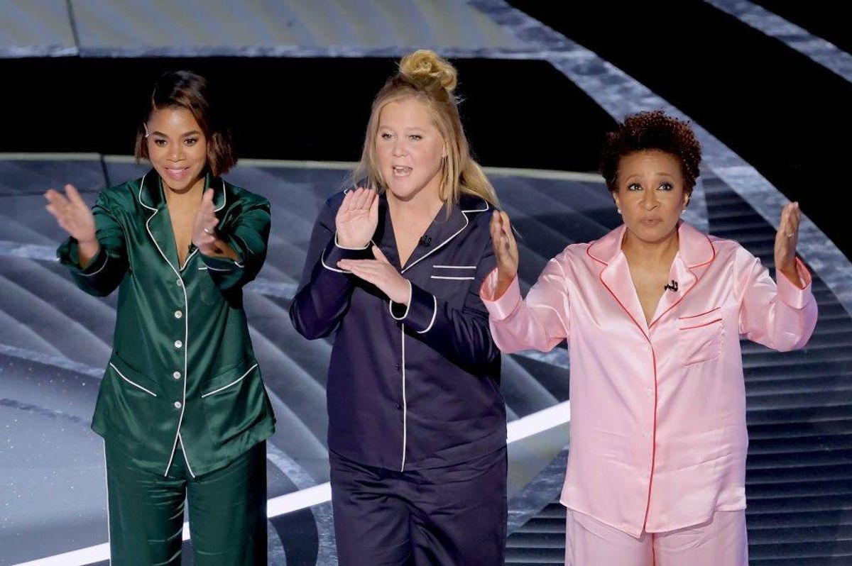 (L-R) Co-hosts Regina Hall, Amy Schumer, and Wanda Sykes speak onstage during the 94th Annual Academy Awards at Dolby Theatre on March 27, 2022 in Hollywood, California.
