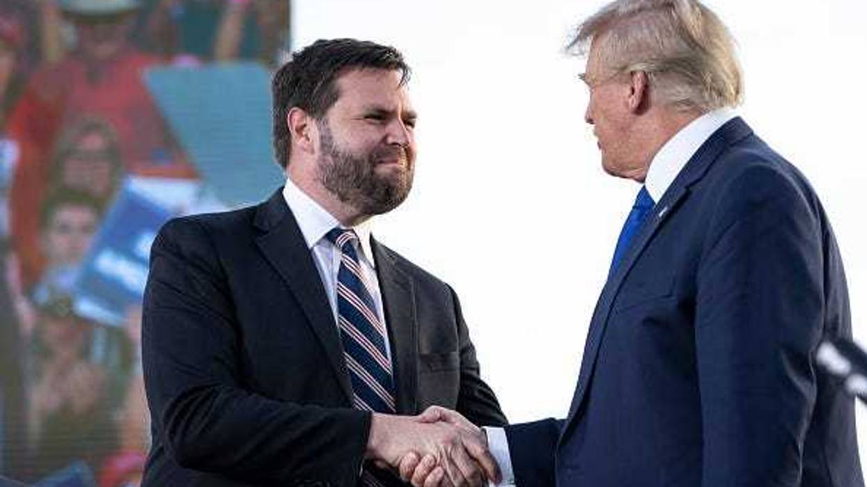 (L-R) J.D. Vance, a Republican candidate for U.S. Senate in Ohio, shakes hands with former President Donald Trump during a rally hosted by the former president at the Delaware County Fairgrounds on April 23, 2022 in Delaware, Ohio.